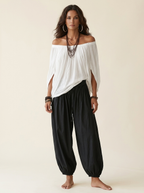 Alba | Conjunto de Top Blanco de Hombros Descubiertos y Pantalón Farol Negro